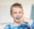 Elementary school boy brushing teeth