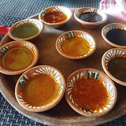 Tasting of traditional moles from Oaxaca’s Central Valleys, each small plate featuring a different variety accompanied by an explanation of its ingredients and origin.