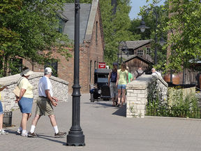 Greenfield Village Michigan in Dearborn featuring historic buildings, visitors walking, and early American village life