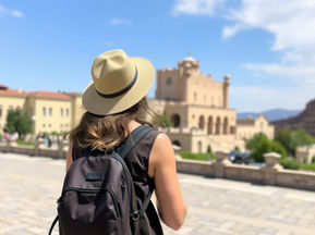 Traveler exploring a historic landmark while planning a realistic travel itinerary with multiple attractions in one day