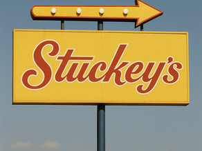 Stuckey’s history featured image showing a nostalgic roadside store with teal roof and vintage sign, symbolizing the rise, fall, and revival of the classic American travel stop.