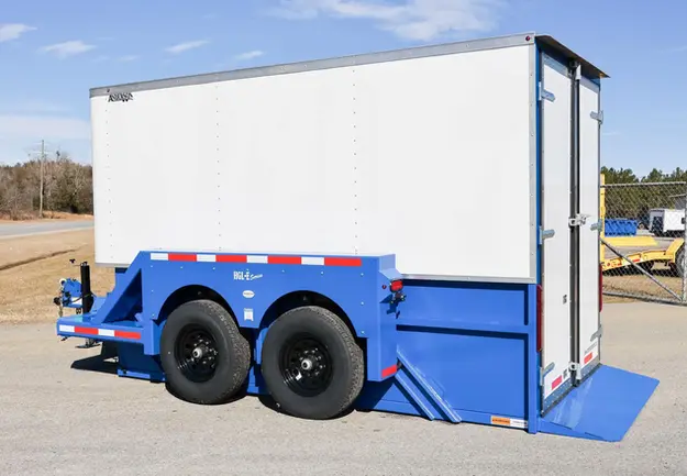 Blue enclosed drop deck trailer with white aluminum box.
