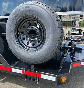 Spare tire and bracket mounted on trailer