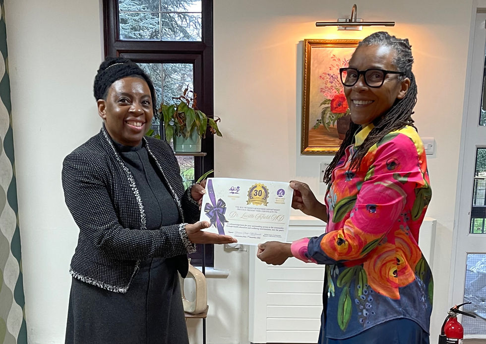 Sharon Platt-McDonald presenting the Global Women's Ministries certificate to Dr Lucille Fifield