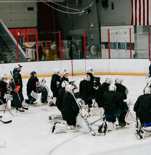 Dad talking to goalies - CPGS Elite Camp 2022.jpg