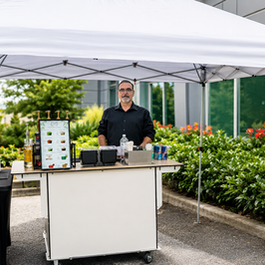 Mobile coffee and matcha bar setup under a white tent for an outdoor Seattle-area event.
