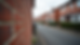 Eye-level view of a brick party wall between two residential houses