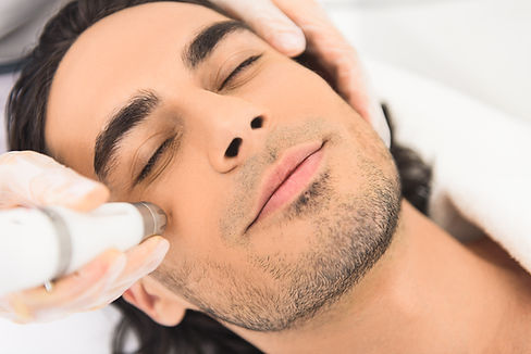 ethnic man microneedling.jpg