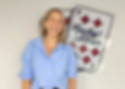 A woman standing in front of the Lucky Seven logo