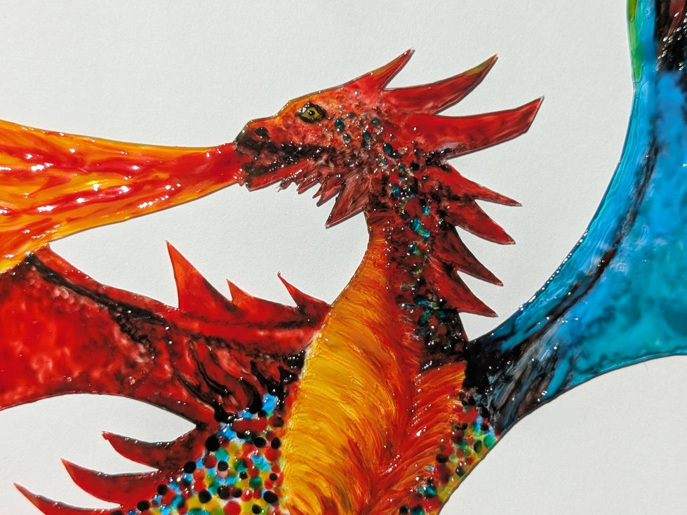 Detail of a hand-painted sun-catcher in the shape of a flying dragon