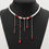 Thumbnail: Gothic romance pearl choker necklace. Red beaded blood necklace on a black mannequin. Anti-tarnish affordable jewelry India