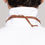 Thumbnail: natural wood laser cut bow tie engraved with scratch texture designed by Daniel Roa faux suede back detail
