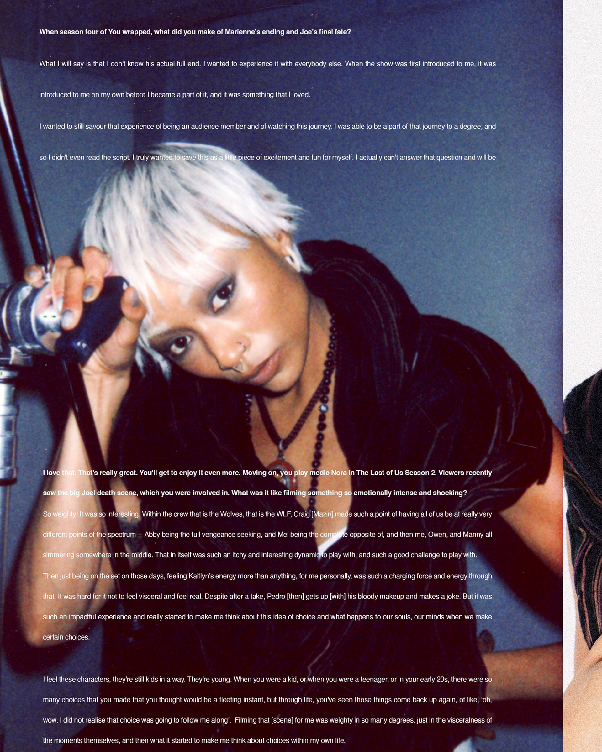 Person with short white hair holds a c-stand against a blue background. They wear dark clothing and a necklace. White text overlays the image.