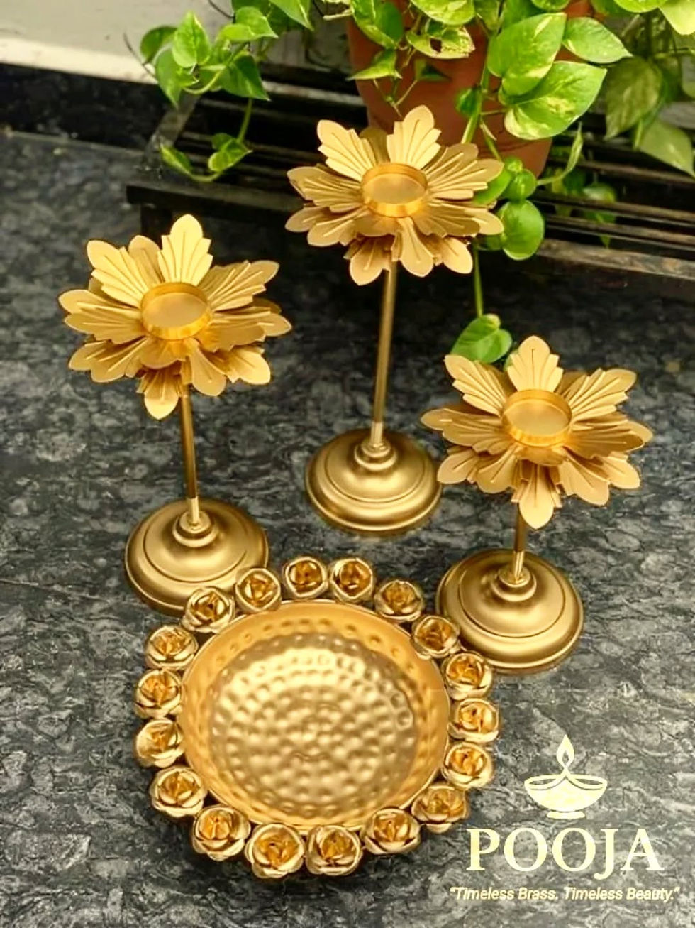 Golden lotus metal urli filled with floating flowers and tealight candles