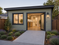 Accessible PWD-friendly JADU garage conversion in Lathrop, California featuring a wide wheelchair-accessible entry door, zero-step concrete walkway, modern exterior design, and compact California garage conversion layout.