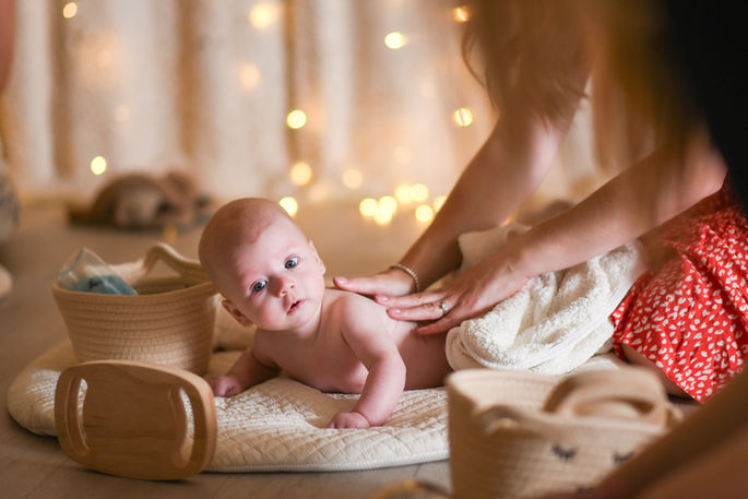 Baby enjoying tummy time at baby massage class in warwick