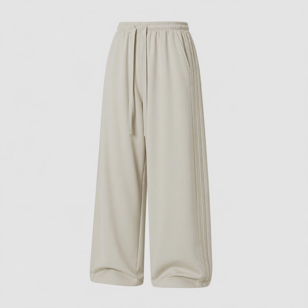 Aero Drift Wide-Leg Trek Pants with relaxed fit, side pleat detailing, elastic waistband, and drawstring closure