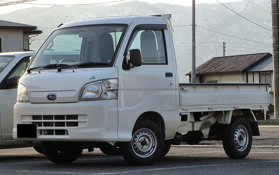 A white Subaru Sambar mini truck.