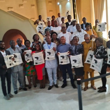 A large group of participants from PCI and the local community, gathered together after a training session promoting business improvement and anti-trafficking awareness.