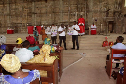 A Patriotic Citizens Initiative trainer conducting an awareness session in a classroom, discussing migration risks and prevention strategies.