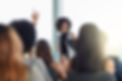 Question, black woman and smile in seminar, speaker and audience in event, training and pr