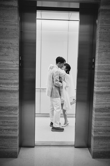 Couple kissing inside an elevator at the Travis County Courthouse in downtown Austin