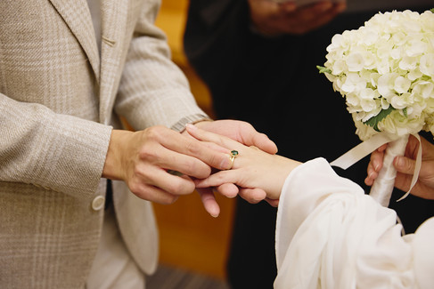 Ring exchange during a courthouse wedding ceremony at the Travis County Courthouse in downtown Austin