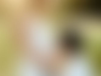 Father kissing the baby bump during a maternity photography session in South Austin