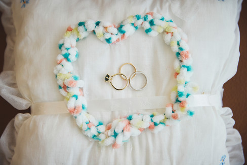 Wedding rings arranged in a heart shape during a Travis County Courthouse wedding in Austin