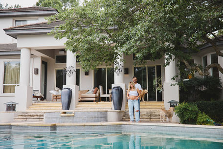 Lifestyle maternity session photographed by an Austin in-home maternity photographer at the couple’s home, using their backyard and outdoor spaces.