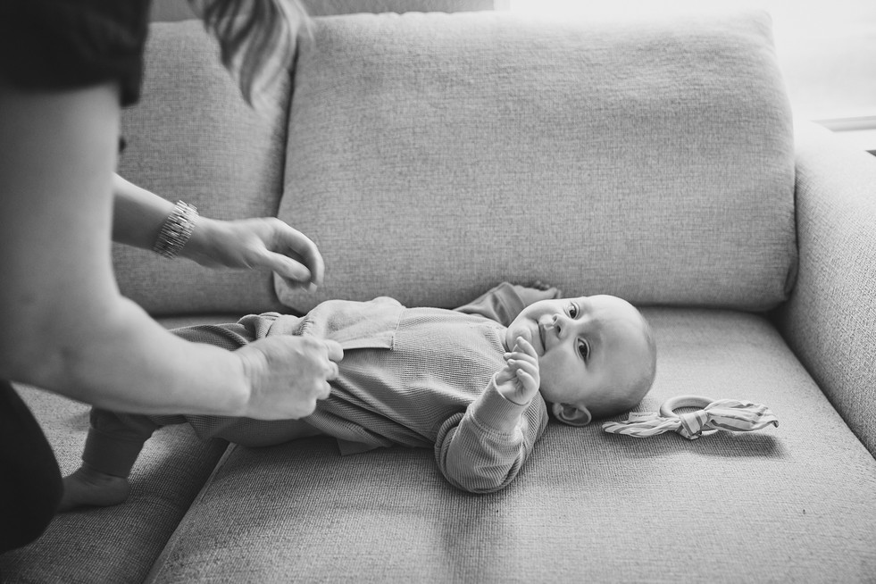 Baby boy lying on sofa