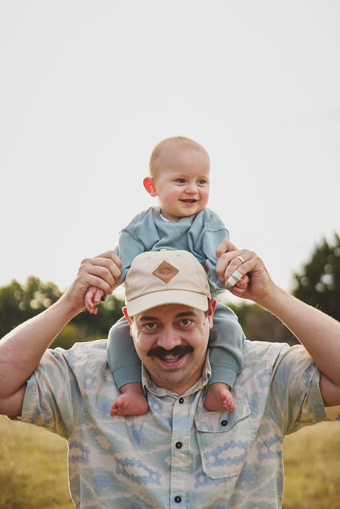 Father and baby boy doing shoulder ride at Mary Moore Searight Metropolitan Park.