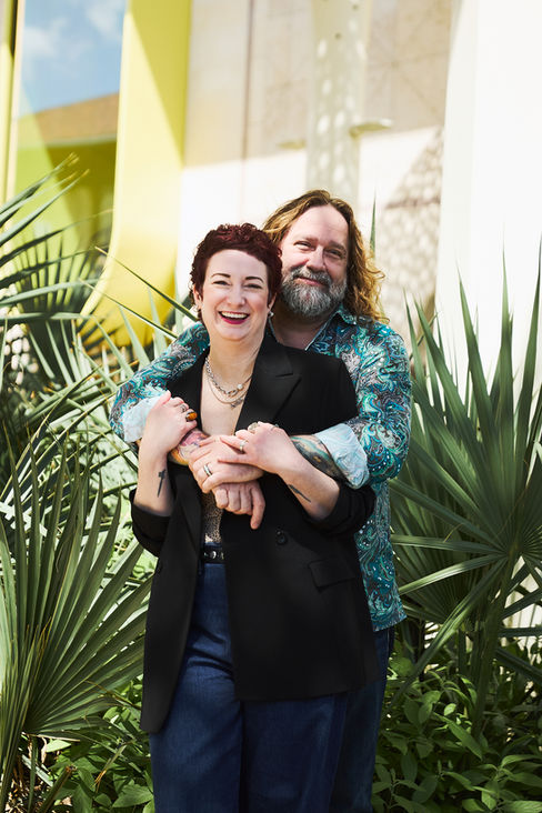 Happy couple laughing together during an Austin couple photography session at the Blanton Museum.