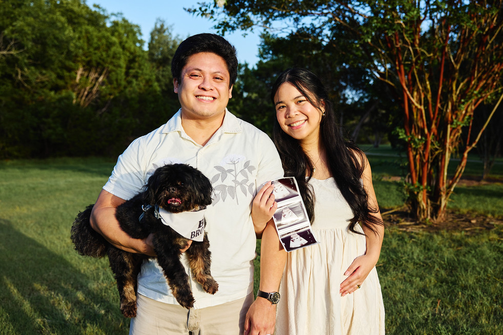 Couple with their dog celebrating pregnancy during an Austin maternity photography session