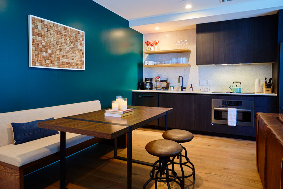 Airbnb kitchen and dining interior with natural light, lifestyle branding photography for hospitality space