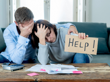 A stressed couple is seeking help for debt management.