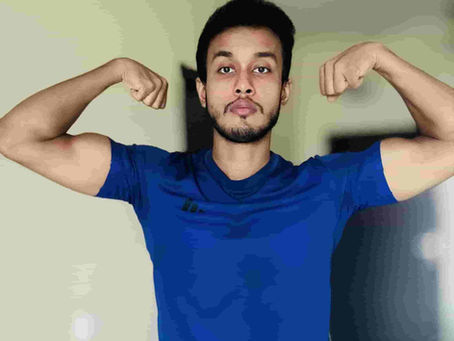Kaushik Bose coaching a client on progressive muscle-building exercises