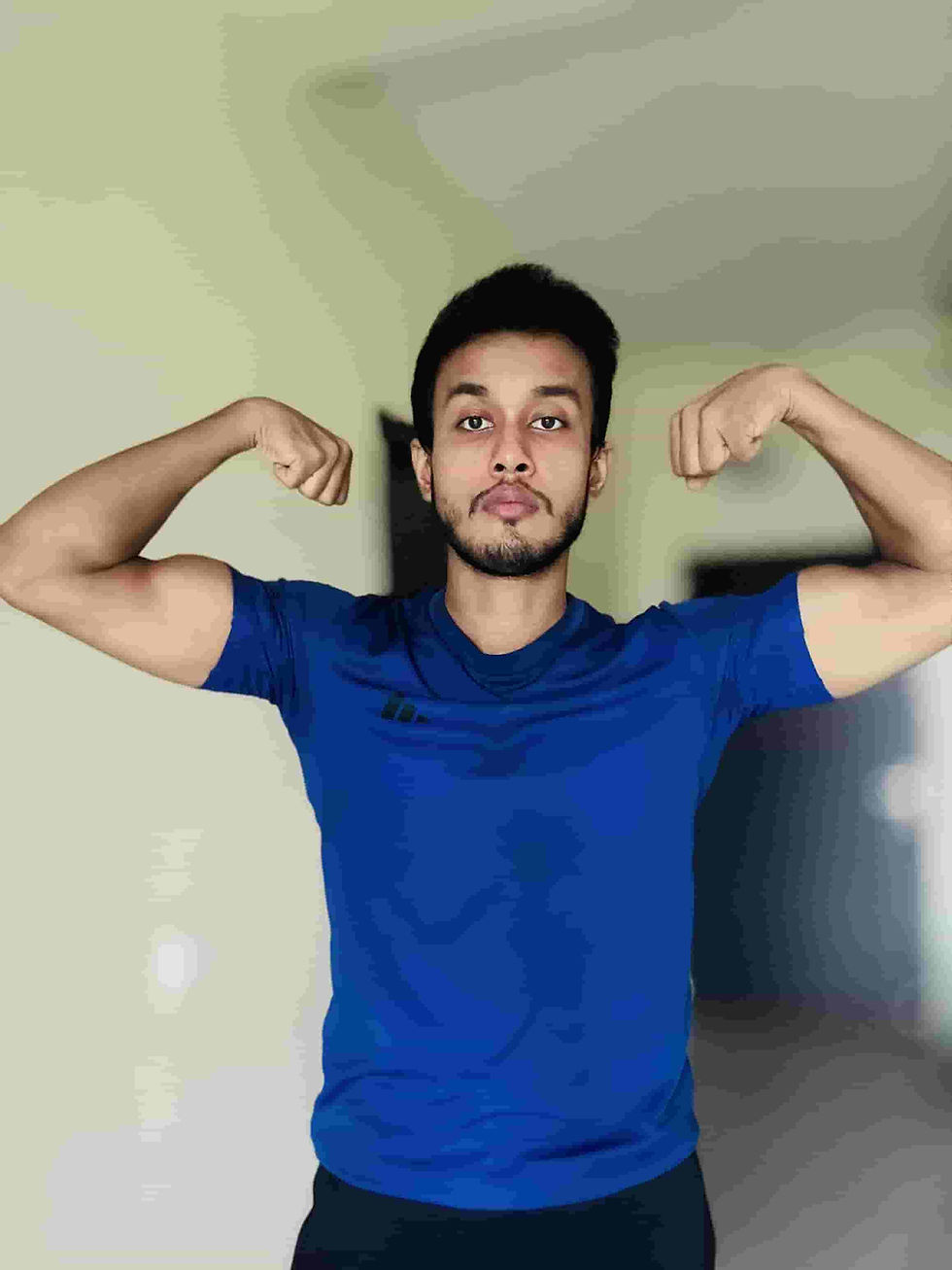 Kaushik Bose coaching a client on progressive muscle-building exercises