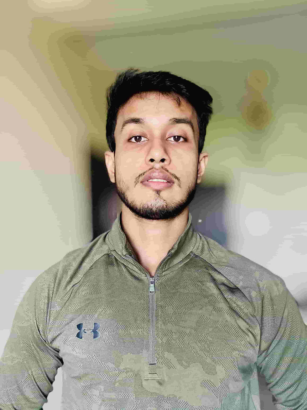 Personal trainer Kaushik Bose demonstrating strength training exercise with client in Kolkata gym