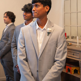 Multicultural wedding groom sees bride
