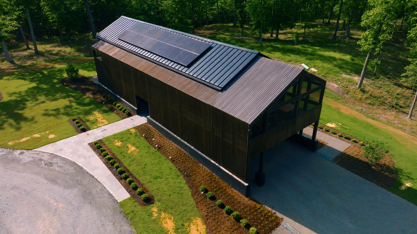 High-angle aerial view of the Nevills Creek House highlighting its energy-efficient design