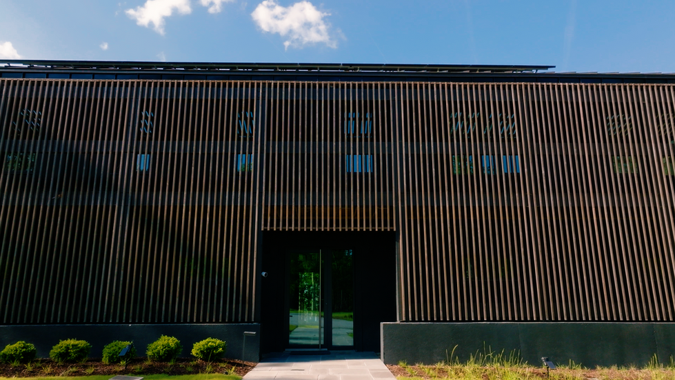 View of vertical wood slats that act as a passive architectural screen to reduce solar heat gain.