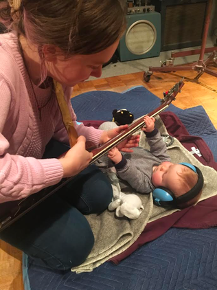 Breastfeeding and Bass Playing: Navigating Early Parenthood While Playing in a Band