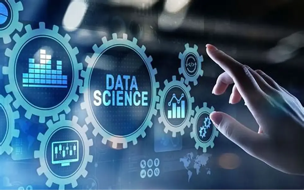 A digital interface displays interconnected gears representing data science concepts, as a hand interacts with the virtual elements.