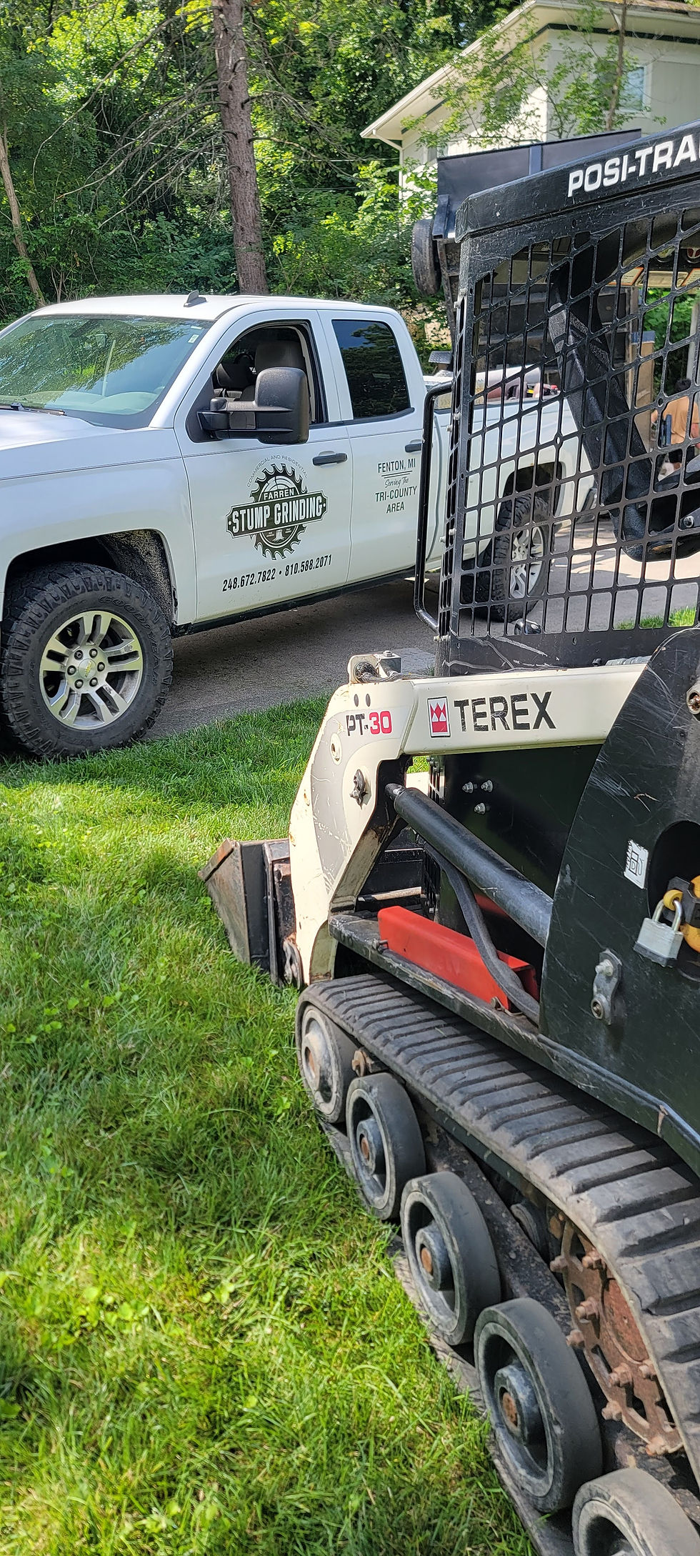 Skid loader used for removing stump grindings