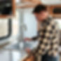man repairing an rv sink.jpg
