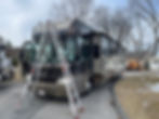 picture of a grand design rv being inspected