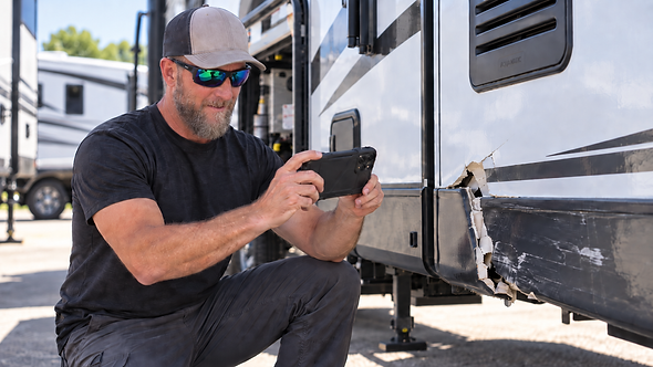 Brian taking photo of damage on an RV