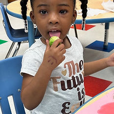 Cute kid trying new food brussel sprouts for the first time because of Thrive n Play Food School Groups