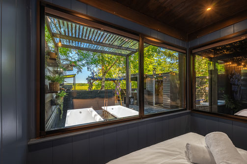 the mad house luxury glamping at wonderland retreats lancashire bed view